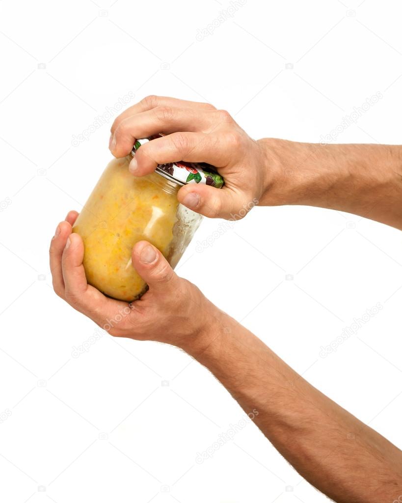 Hands open the jar isolated on white background