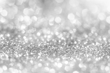 Soyut parlak ve parlak bokeh arka plan. Gümüş ve Pırlanta bulanık bokeh glitter doku aydınlatma toz