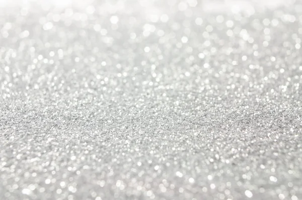 Soyut parlak ve parlak bokeh arka plan. Gümüş ve Pırlanta bulanık bokeh glitter doku aydınlatma toz