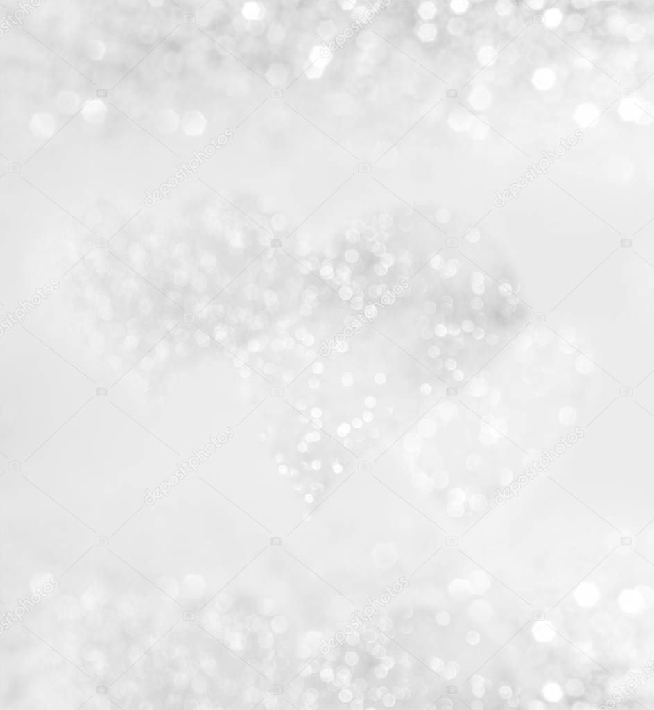 Abstract silver romantic background with heart and lights.