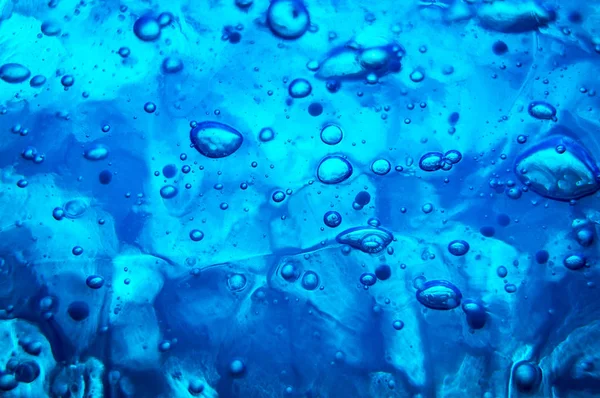 Drops of water on a blue glass — Stock Photo, Image