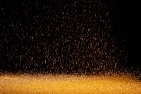 The texture of the fall of gold particles — Stock Photo, Image