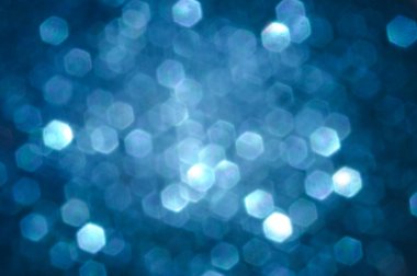 Bokeh daireleri ile bulanık mavi arkaplan .