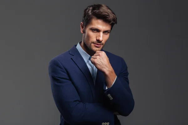 Thoughtful young brunette man in blue jacket thinking about something — Stock Photo, Image