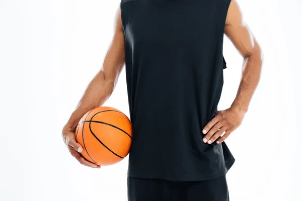 Cropped image of an african basketball player holding ball — Stock Photo, Image