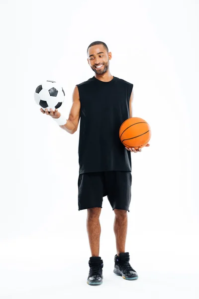 Portrait of a smiling sports man looking at soccer ball — Stock Photo, Image