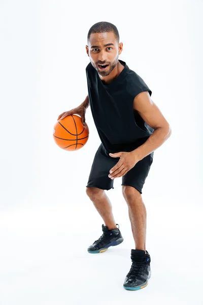 Full length portrait of an african man playing basketball — Stock Photo, Image