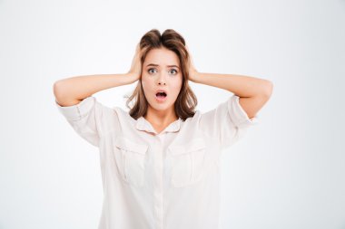 Woman covering ears and shouting