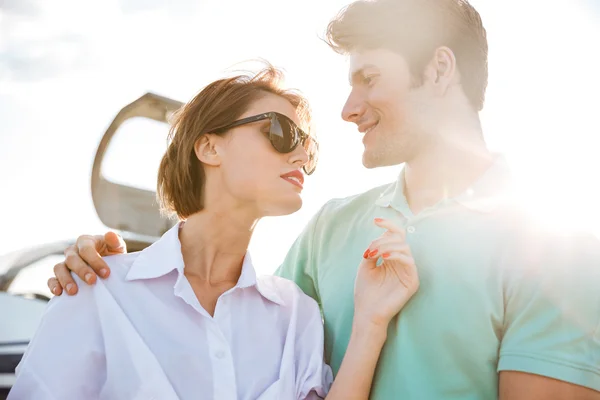 Beautiful young couple near small airplane — Stock Photo, Image