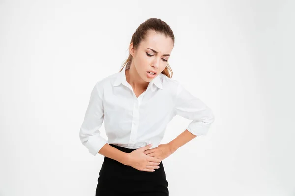 Retrato de una joven empresaria con dolor de estómago — Foto de Stock