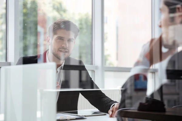 Two attractive young businessmen talking on business meeting in office — Stock Photo, Image