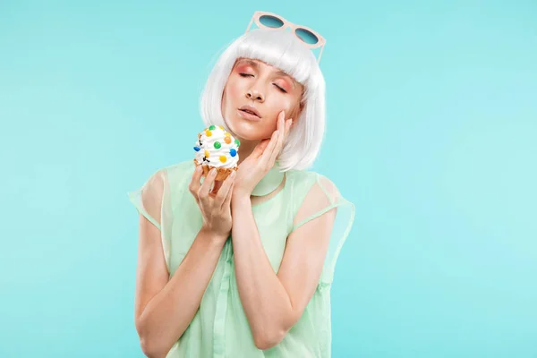 Portrait of attractive sensual blonde young woman with cupcake — Stock Photo, Image