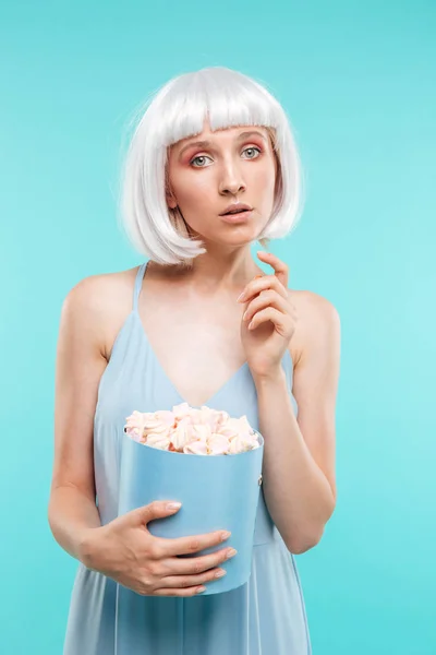 Portrait of beautiful blonde young woman with marshmallows — Stock Photo, Image