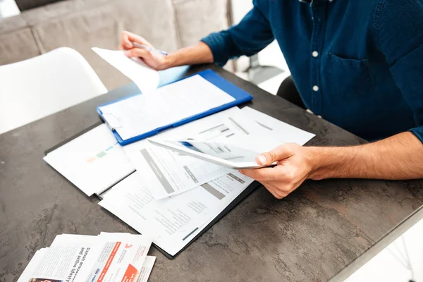 Cropped picture of young man's hands holding documents — Stock Photo, Image