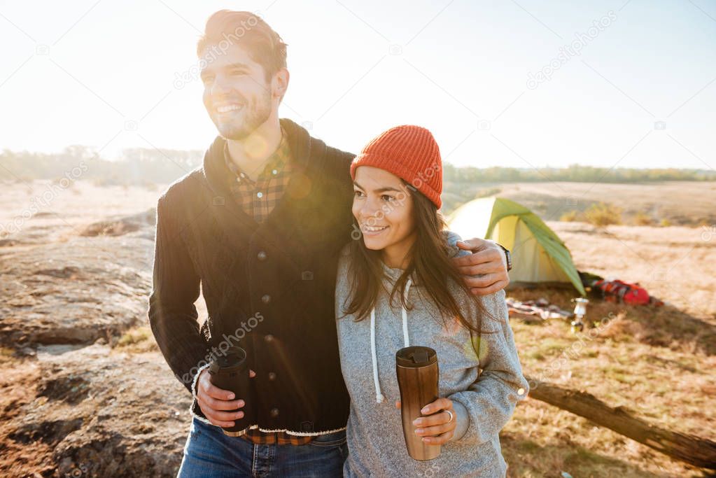 Couple standing near the tent