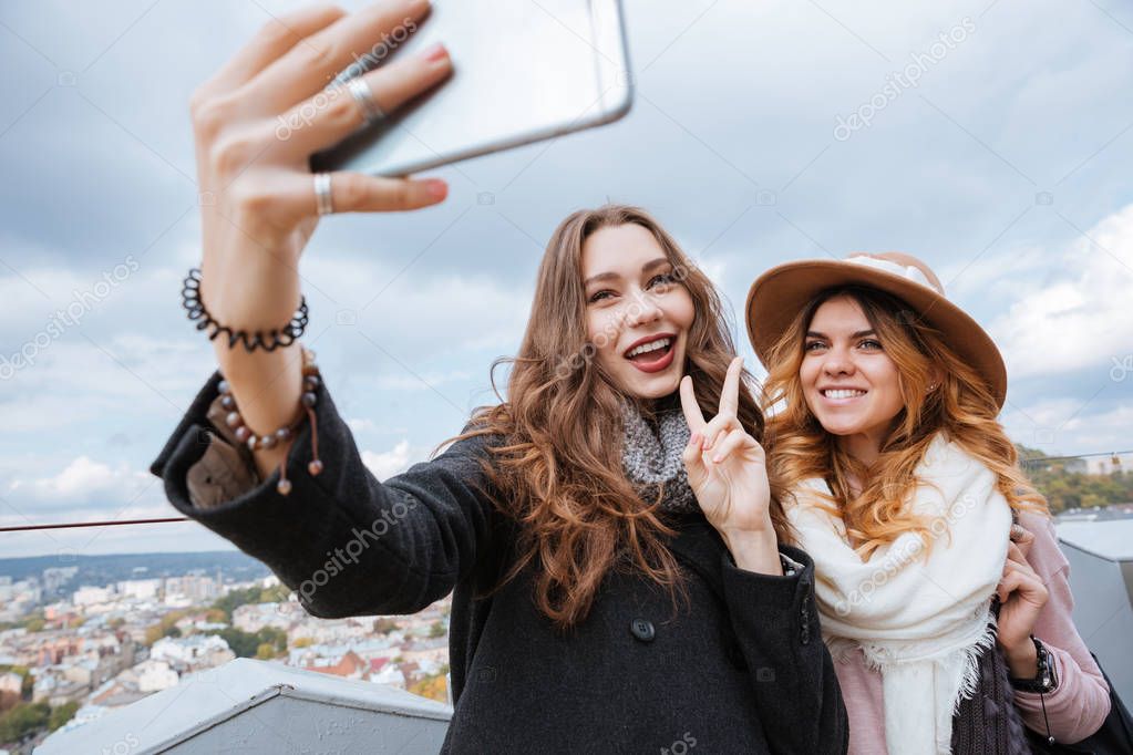 Funny girls make a selfie