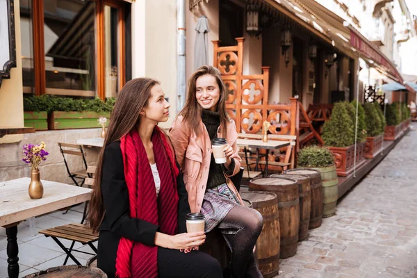 Models in coats are sitting — Stock Photo, Image