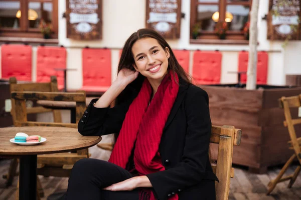 Model in coat sitting — Stock Photo, Image