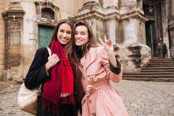 Image of beautiful girls in coats — Stock Photo, Image