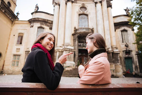 From the back photo of girls in coats — Stock Photo, Image