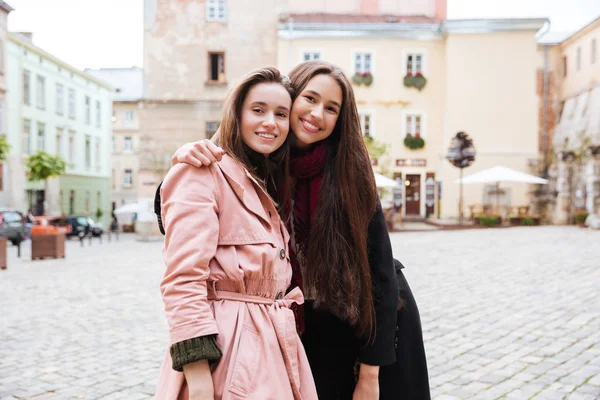 Young friends in coats — Stock Photo, Image