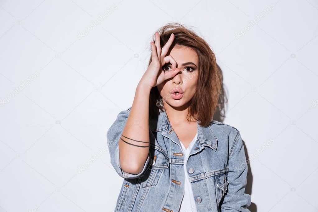 Lady make funny face over white background