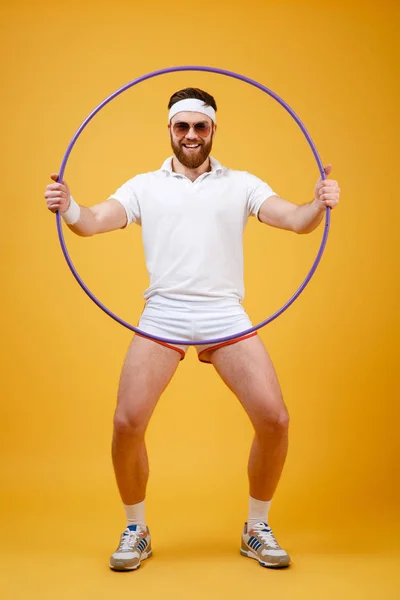 Happy young sportsman with gymnastic hoop — Stock Photo, Image