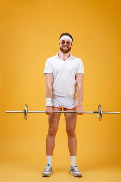 Cheerful young sportsman make sport exercises with barbell — Stock Photo, Image