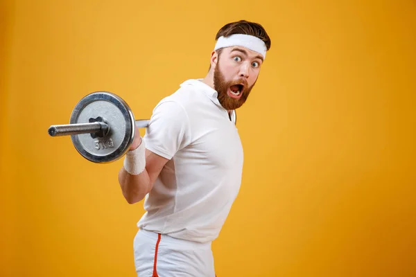 Portréja egy izgatott szakállas fitness ember edzés — Stock Fotó