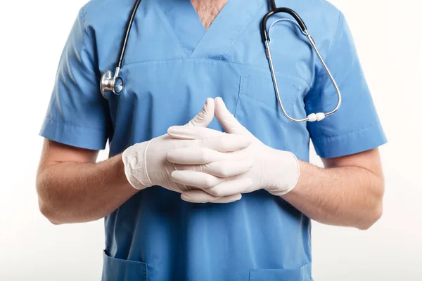 Male medical doctor or nurse wearing surgical gloves and stethoscope — Stock Photo, Image