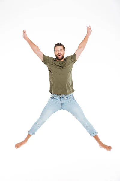 Jovem feliz pulando isolado sobre fundo branco — Fotografia de Stock