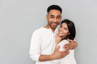 Young african man hugging woman clipart