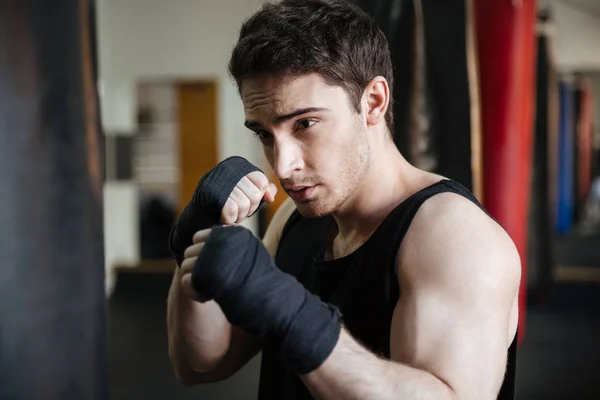 Close up view of boxer training with punchbag — Stock Photo, Image