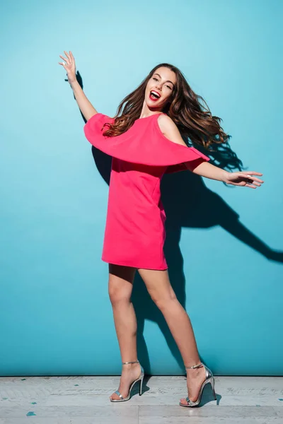 Full length portrait of a pretty girl in dress posing — Stock Photo, Image