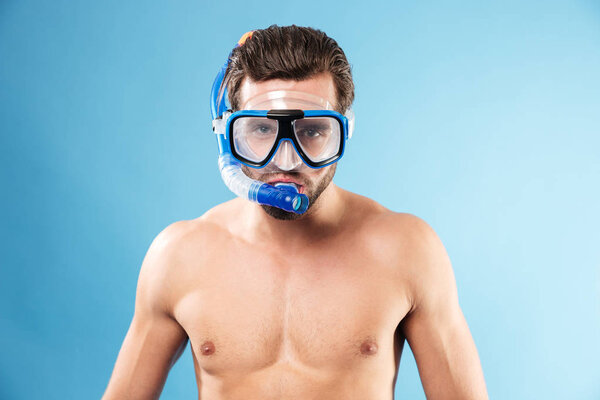 Portrait of a young man wearing swimming mask and snorkel