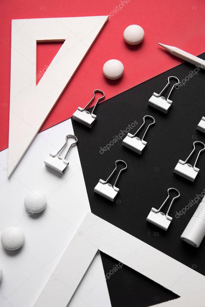 Office supplies on the white red and black background table