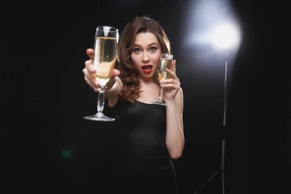 Happy woman wit red lips giving you glass of champagne — Stock Photo, Image