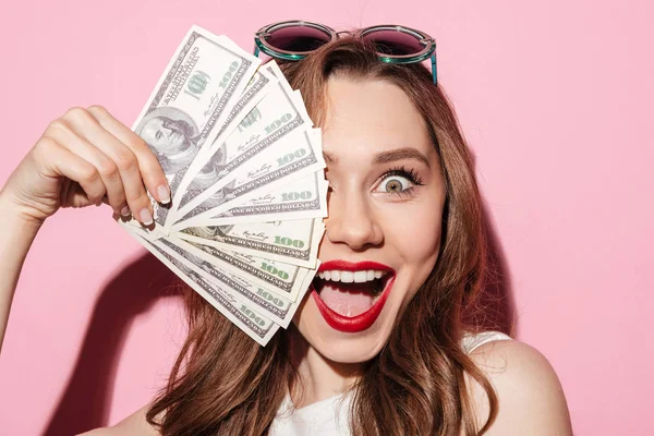 Happy young brunette lady holding money — Stock Photo, Image