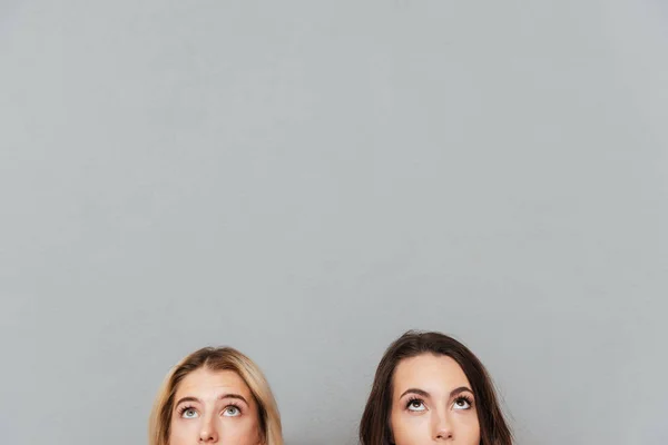Pretty young women looking at copyspace. — Stock Photo, Image