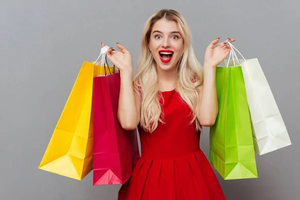 Blonde woman with packages — Stock Photo, Image