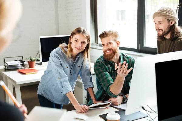 Happy colleagues in office talking with each other — Stock Photo, Image