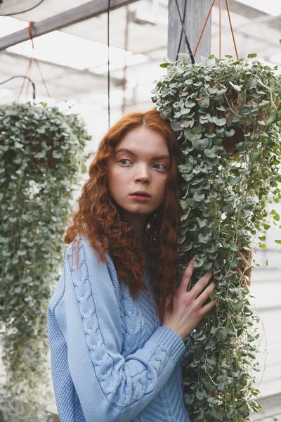 Girl touching plants — Stock Photo, Image