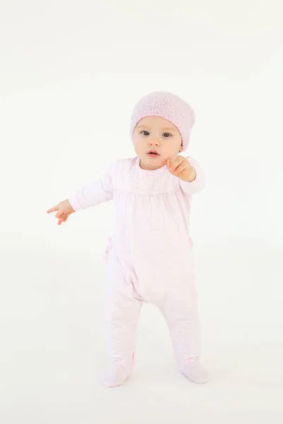 Cute little baby wearing hat standing on floor isolated — Stock Photo, Image