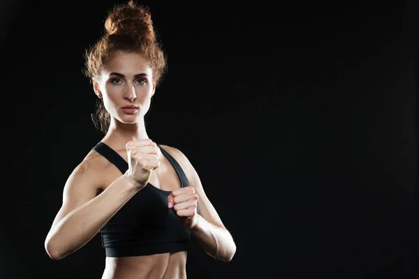 Concentrated young sports lady boxer — Stock Photo, Image
