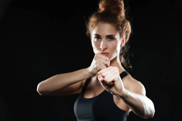 Serious young sports lady boxer posing. — Stock Photo, Image