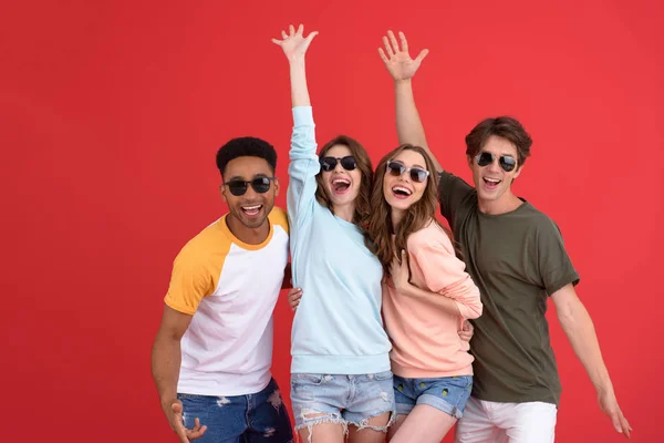 Young happy group of friends standing isolated — Stock Photo, Image