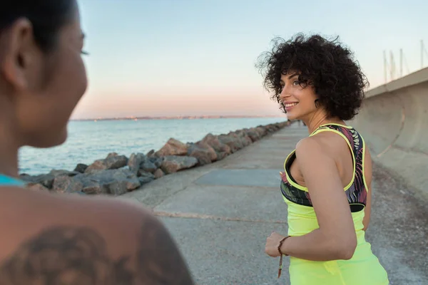 Close up of two young sportswomen running — Stock Photo, Image