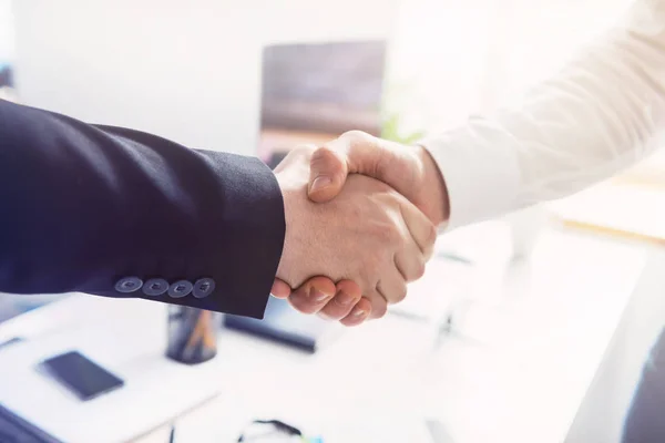 Close up of two successful businessmen shaking hands — Stock Photo, Image