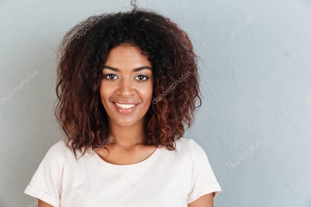 Close up portrait of a smiling casual afro american woman