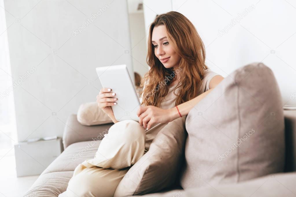 Amazing pretty lady using tablet computer.